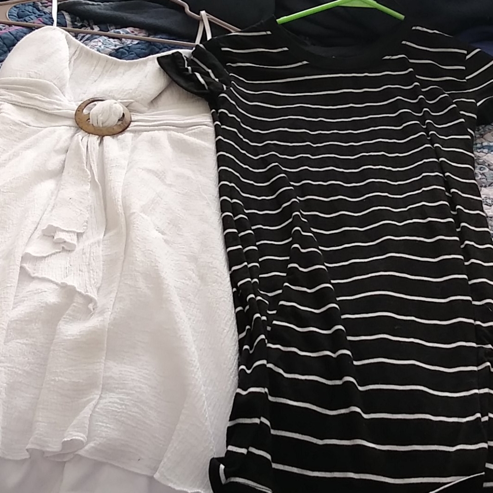 Dresses and unused lipsticks and one pair of shoes